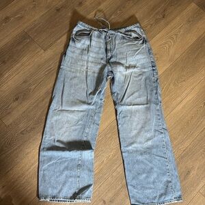 Wide leg, ultra soft badge jeans. With tie waist